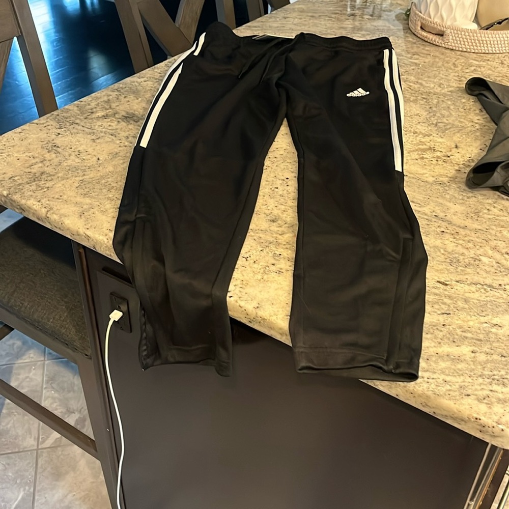 Women’s adidas tapered leg pants. Size L